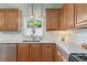 Bright kitchen featuring wood cabinets, stainless steel appliances, and a window view of the outdoors at 5415 Fieldfreen Dr, Cumming, GA 30028