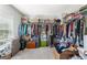 Organized walk-in closet with ample shelving and storage space for clothing and accessories at 5415 Fieldfreen Dr, Cumming, GA 30028