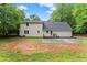 Large backyard with a new patio and a well-maintained lawn, ideal for outdoor activities and entertaining guests at 5902 Wills Orchard Rd, Cumming, GA 30040