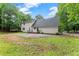 Spacious backyard featuring a new patio, wood deck, and lawn area, great for relaxation and outdoor gatherings at 5902 Wills Orchard Rd, Cumming, GA 30040