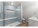 Modern bathroom featuring stylish glass enclosed shower, tile design, and modern vanity at 5902 Wills Orchard Rd, Cumming, GA 30040