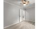Cozy bedroom with neutral walls, carpet, and a bright window at 5902 Wills Orchard Rd, Cumming, GA 30040