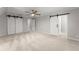 Large bedroom with carpet, barn doors, and neutral walls at 5902 Wills Orchard Rd, Cumming, GA 30040