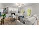 Cozy living room featuring a fireplace, built-in cabinets, and stylish decor at 5902 Wills Orchard Rd, Cumming, GA 30040