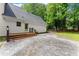 A spacious patio with modern pavers and a wood deck, perfect for outdoor entertaining and relaxation at 5902 Wills Orchard Rd, Cumming, GA 30040