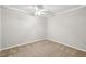 Bright bedroom features neutral walls and ceiling fan at 6806 Glenridge Dr # E, Atlanta, GA 30328