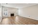 Spacious living room featuring wood floors and a fireplace with tiled hearth at 6806 Glenridge Dr # E, Atlanta, GA 30328