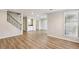Open concept room features hardwood floors, staircase and natural light at 6806 Glenridge Dr # E, Atlanta, GA 30328