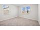 Bedroom featuring plush carpeting and windows at 1246 Allspice Way, Lawrenceville, GA 30045