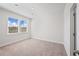 Carpeted bedroom featuring neutral paint and good natural light at 1246 Allspice Way, Lawrenceville, GA 30045
