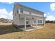Exterior shot of the house highlighting the back patio and expansive backyard at 1246 Allspice Way, Lawrenceville, GA 30045