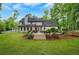 Exterior of home with a spacious green backyard at 1384 Independence Way, Marietta, GA 30062