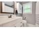 Bright bathroom with white vanity, modern fixtures, and a large mirror at 1384 Independence Way, Marietta, GA 30062