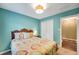 Cozy bedroom with a paisley bedspread, closet, and door to another room at 1384 Independence Way, Marietta, GA 30062