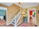 Inviting foyer with hardwood floors and staircase, showcasing a glimpse into other rooms at 1384 Independence Way, Marietta, GA 30062