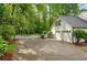 Garage with a basketball hoop, picket fence, and landscaped backyard at 1384 Independence Way, Marietta, GA 30062