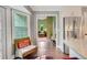 Kitchen nook with a wicker chair and view to a living room, enhancing the appeal of the home at 1384 Independence Way, Marietta, GA 30062