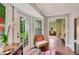 Bright kitchen nook with double french doors leading to a well-maintained garden, perfect for indoor-outdoor living at 1384 Independence Way, Marietta, GA 30062