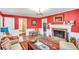 Warm living room showcasing fireplace, hardwood floors, and a seamless transition to the adjacent rooms at 1384 Independence Way, Marietta, GA 30062