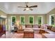 Spacious living room boasts multiple windows for natural light and comfortable seating to relax and unwind at 1384 Independence Way, Marietta, GA 30062