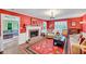 Inviting living room with hardwood floors, fireplace, and adjacent room with large sectional sofa at 1384 Independence Way, Marietta, GA 30062