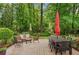 Cozy patio featuring comfortable seating and a dining area, ideal for enjoying the serene backyard at 1384 Independence Way, Marietta, GA 30062