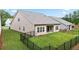 Wide backyard featuring a covered patio and a fence at 169 Hickory Bluffs Pkwy, Canton, GA 30114