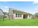 Well-maintained backyard with a fenced perimeter, featuring a covered patio at 169 Hickory Bluffs Pkwy, Canton, GA 30114