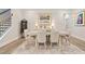 Spacious dining room featuring hardwood floors, neutral paint, a decorative rug, and lots of natural light at 169 Hickory Bluffs Pkwy, Canton, GA 30114