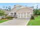 Inviting single Gathering home with a 2 car garage, neutral siding, stone accents, manicured lawn, and sidewalk at 169 Hickory Bluffs Pkwy, Canton, GA 30114
