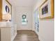 Bright foyer features wood floors, neutral paint, transom window door and glass french doors at 169 Hickory Bluffs Pkwy, Canton, GA 30114