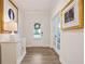 Inviting foyer featuring hardwood floors, neutral paint, a decorative light fixture, and access to a study at 169 Hickory Bluffs Pkwy, Canton, GA 30114