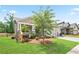 Charming single Gathering home features a covered porch, 2 car garage, and landscaped front yard at 169 Hickory Bluffs Pkwy, Canton, GA 30114