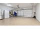Spacious two-car garage with an epoxy floor, offering ample storage and parking at 169 Hickory Bluffs Pkwy, Canton, GA 30114