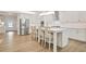Modern kitchen features stainless steel appliances, white cabinetry and large center island at 169 Hickory Bluffs Pkwy, Canton, GA 30114