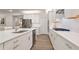 Modern kitchen featuring white cabinets, stainless steel appliances, and stylish backsplash at 169 Hickory Bluffs Pkwy, Canton, GA 30114