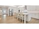 Gourmet kitchen boasts a large center island, stainless steel appliances, white cabinets, and lots of natural light at 169 Hickory Bluffs Pkwy, Canton, GA 30114