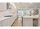 Open kitchen with a large island, stainless steel appliances, and hardwood floors at 169 Hickory Bluffs Pkwy, Canton, GA 30114