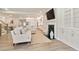 Open-concept living room with hardwood floors, fireplace, and view into the kitchen at 169 Hickory Bluffs Pkwy, Canton, GA 30114