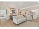Open living space with hardwood flooring, view into kitchen, and lots of natural light at 169 Hickory Bluffs Pkwy, Canton, GA 30114