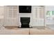 Bright living room features a cozy fireplace with built-in shelving, offering both style and functionality at 169 Hickory Bluffs Pkwy, Canton, GA 30114