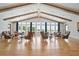 Comfortable lounge area with leather chairs, hardwood floors, and lots of natural light at 169 Hickory Bluffs Pkwy, Canton, GA 30114