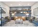 A comfy lounge area with a stylish sofa, chairs, and shelving for books and decor at 169 Hickory Bluffs Pkwy, Canton, GA 30114