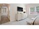 Bright main bedroom with view to hall, large dresser and large screen tv at 169 Hickory Bluffs Pkwy, Canton, GA 30114
