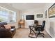 Bright office space with a comfortable leather chair and a large window for natural light at 169 Hickory Bluffs Pkwy, Canton, GA 30114