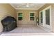 Cozy covered patio area with a ceiling fan, perfect for outdoor entertaining at 169 Hickory Bluffs Pkwy, Canton, GA 30114