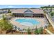 Resort style pool with lounge chairs and clubhouse in a well maintained community at 169 Hickory Bluffs Pkwy, Canton, GA 30114