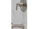 Modern shower fixtures with white marble tiling creating an elegant and spa-like bathroom at 169 Hickory Bluffs Pkwy, Canton, GA 30114