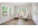 Bright sitting room with two arm chairs that allow for relaxing with great natural light through the windows at 169 Hickory Bluffs Pkwy, Canton, GA 30114