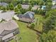 Aerial view of a large yard with green grass and mature trees at 2430 Tack Hill Ct, Dacula, GA 30019